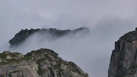 Fog rolling over mountain peaks in Ergaki Stock Footage 300939074