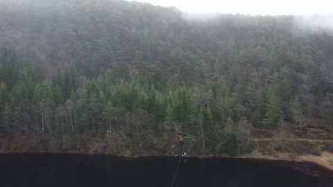 Fog rolling over a Norwegian lake and forest Video stock 335199364