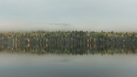 Fog Rolling in Over a Remote Lake Stock Footage 169712692