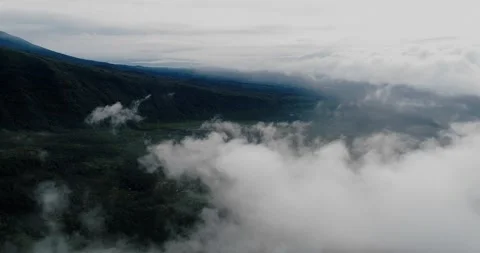 Fog Rolling Over Tropical Mountain Waterfall and Rainforest Hills Aerial 库存影片 329656823
