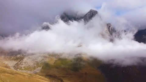 Fog rolling on the rocky peak Stock Footage 168571146