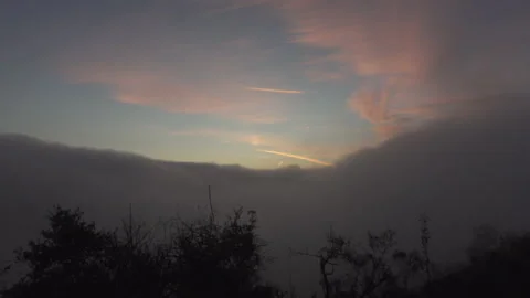 Fog rolls in as the sunsets Stock Footage 165142485