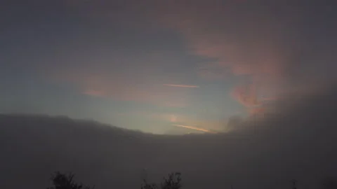 Fog rolls in as the sunsets Stock Footage 165142745