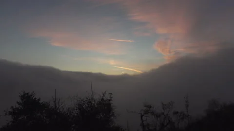 Fog rolls in as the sunsets Stock Footage 165144504