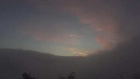 Fog rolls in as the sunsets Stock Footage 165145094