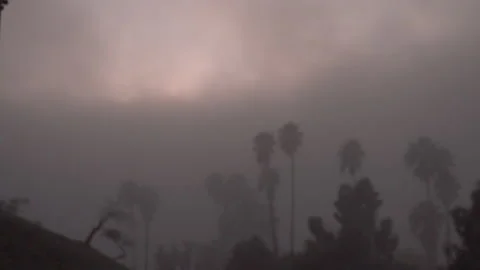 Fog rolls in as the sunsets Stockbeeldmateriaal 165145639