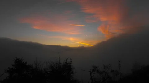 Fog rolls in as the sunsets Stock Footage 165316821