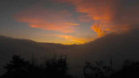 Fog rolls in as the sunsets Stock Footage 165317233