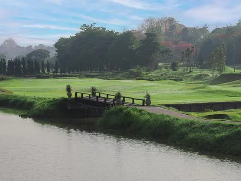 The fog is spread along the fast river early in the morning. 스톡 사진