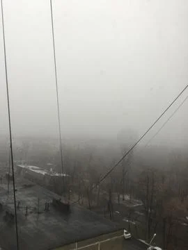Fog on the street view from the window of a multi-storey building Stock Photos