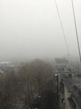 Fog on the street view from the window of a multi-storey building Stock Photos