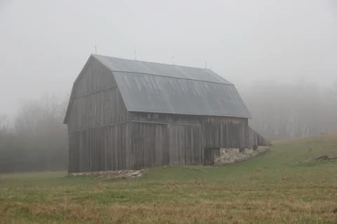 A fog surrounded barn in Sleeping Bear Dunes National Lakeshore, Michigan Stock Photos
