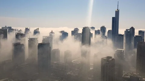 Fog through the skyscrapers time lapse in Dubai Marina Stock Footage 104705307