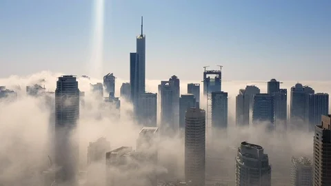 Fog through the skyscrapers time lapse in Dubai Marina Video stock 104706832
