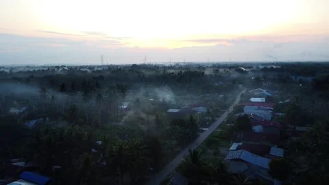 Fog in the village in the Sunset Video stock 312081446
