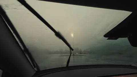 Fogged car windshield during heavy rain, reducing visibility while driving. Stock Footage 332183316