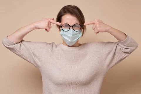 Fogging glasses from the mask. Avoid face touching, Coronavirus prevention Stock Photos