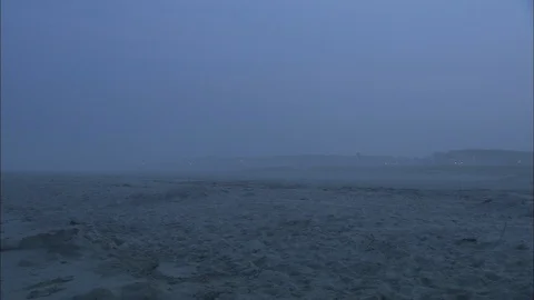 Foggy beach with distant lights Stock Footage 87753365