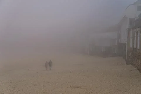 Foggy beach Stock Photos