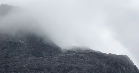 Foggy Clouds Between Mountains 4 Stock Footage 82271977