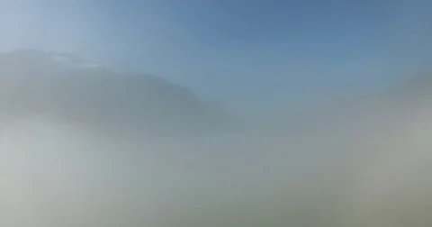 Foggy Clouds Between Mountains Video stock 82269389