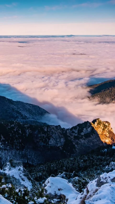 Foggy Clouds Flow in Mountain Valley at Sunrise, Vertical Winter Landscape Stock Footage 317651222