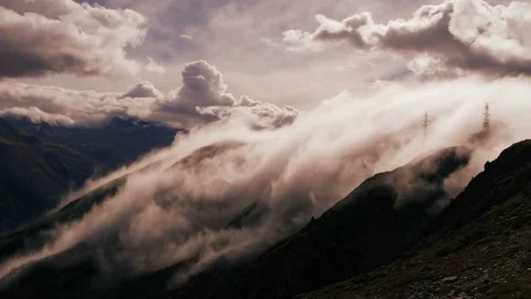Foggy clouds moving fast over landscape scenery showing weather change Stock Footage 72869876