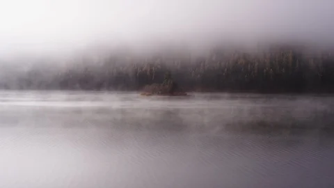 Foggy dramatic scene looking across Swan Lake in Montana Stock Footage 127467392