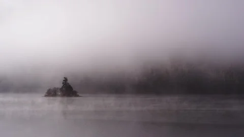 Foggy dramatic scene looking across Swan Lake in Montana Stock Footage 127467521