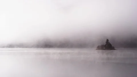 Foggy dramatic scene looking across Swan Lake in Montana Stock Footage 127467669