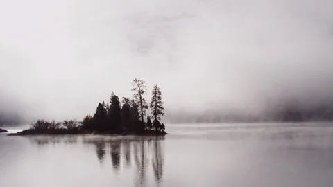 Foggy dramatic scene looking across Swan Lake in Montana Stock Footage 127467804