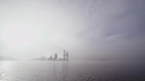 Foggy dramatic scene looking across Swan Lake in Montana Stock Footage 127468339
