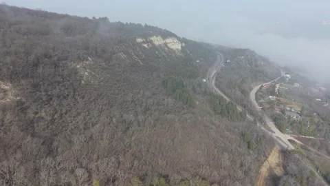 Foggy Forest Road Winding Through Hills Aerial View Stock Footage 328829030