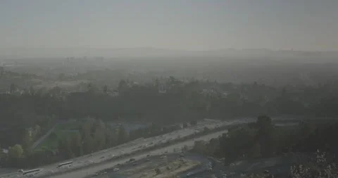 Foggy Freeway and Cityscape Stock Footage 324292920
