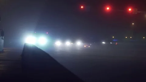 Foggy intersection with cars Stock Footage 72408464