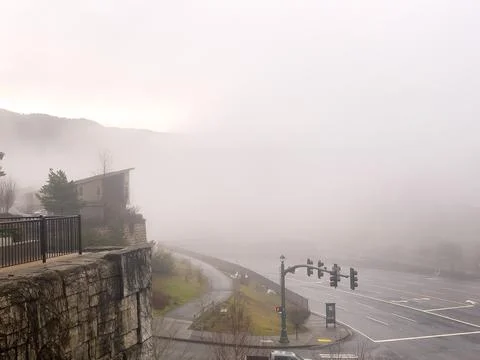 A foggy intersection in the mountains Stock Photos