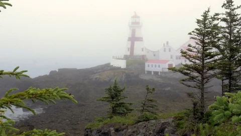 Foggy Lighthouse on Atlantic Ocean Stock Footage 77246490