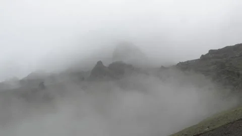 Foggy mountain landscape with dramatic rocky peaks in Iceland 4K footage Video stock 339923138