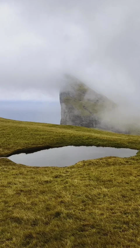 Foggy mountain peaks and clouds covering sea and mountains. Stock Footage 269126743