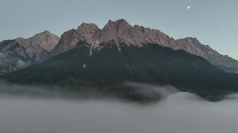 Foggy Mountain Range with Moon Rising Aerial View in Bavaria, Germany Stock Footage 335969178