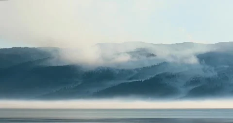 A foggy mountain range is visible in the distance Stock Footage 314241903