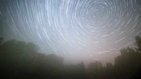 Foggy night time lapse with startrails and small northern lights.. Stock Footage 290074560