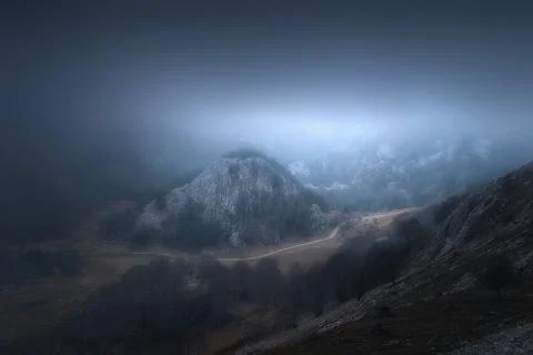 Foggy path in the mountain at evening Stock Photos