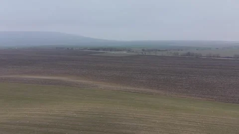 Foggy Rural Landscape with Fields and Distant Hills Stock Footage 328828871