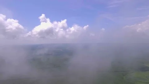 Foggy sky and clouds movements in the sky and green hills landscape Stock Footage 138018698