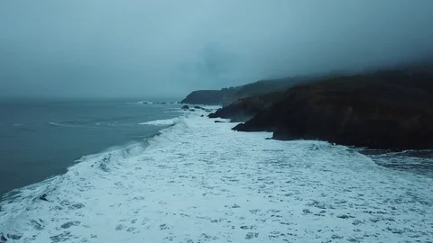 Foggy sunset hovering over waves at Rodeo Beach Stock Footage 94743844