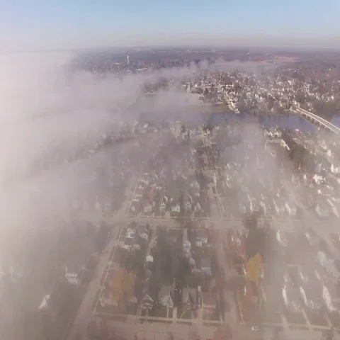 Foggy Town Flyover Stock Footage 69490859