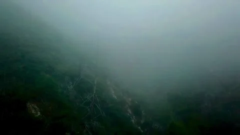 A foggy valley pull back Stock Footage 271313433