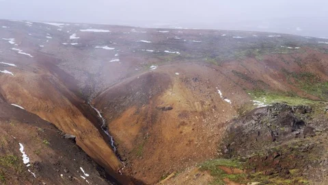 Fog/Mist Moving Fast Over Mountains And Waterfall, Remote Wilderness Of Iceland Video stock 82563531