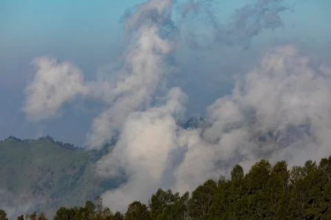 Fogs and low clouds at sunset, to the east, near Bromo volcano, and the Tengg Stock Photos